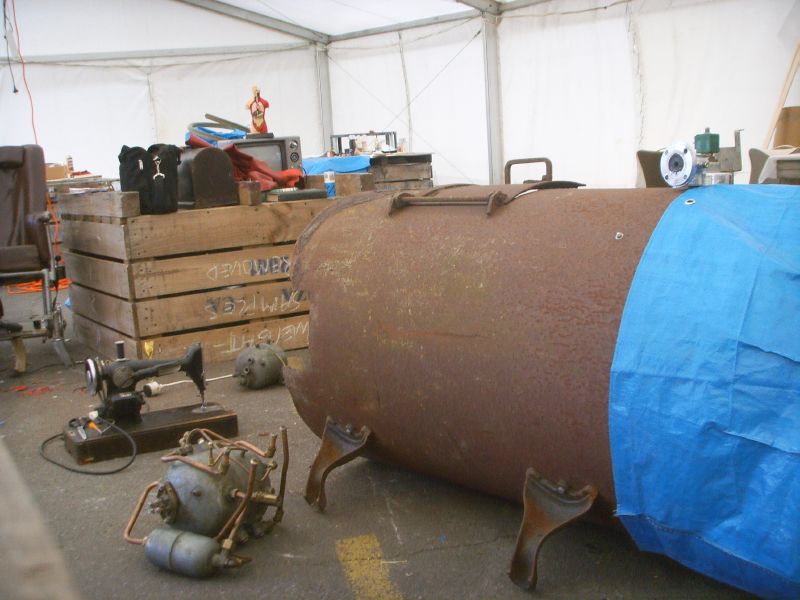 various pipes and other junk sitting in an attic