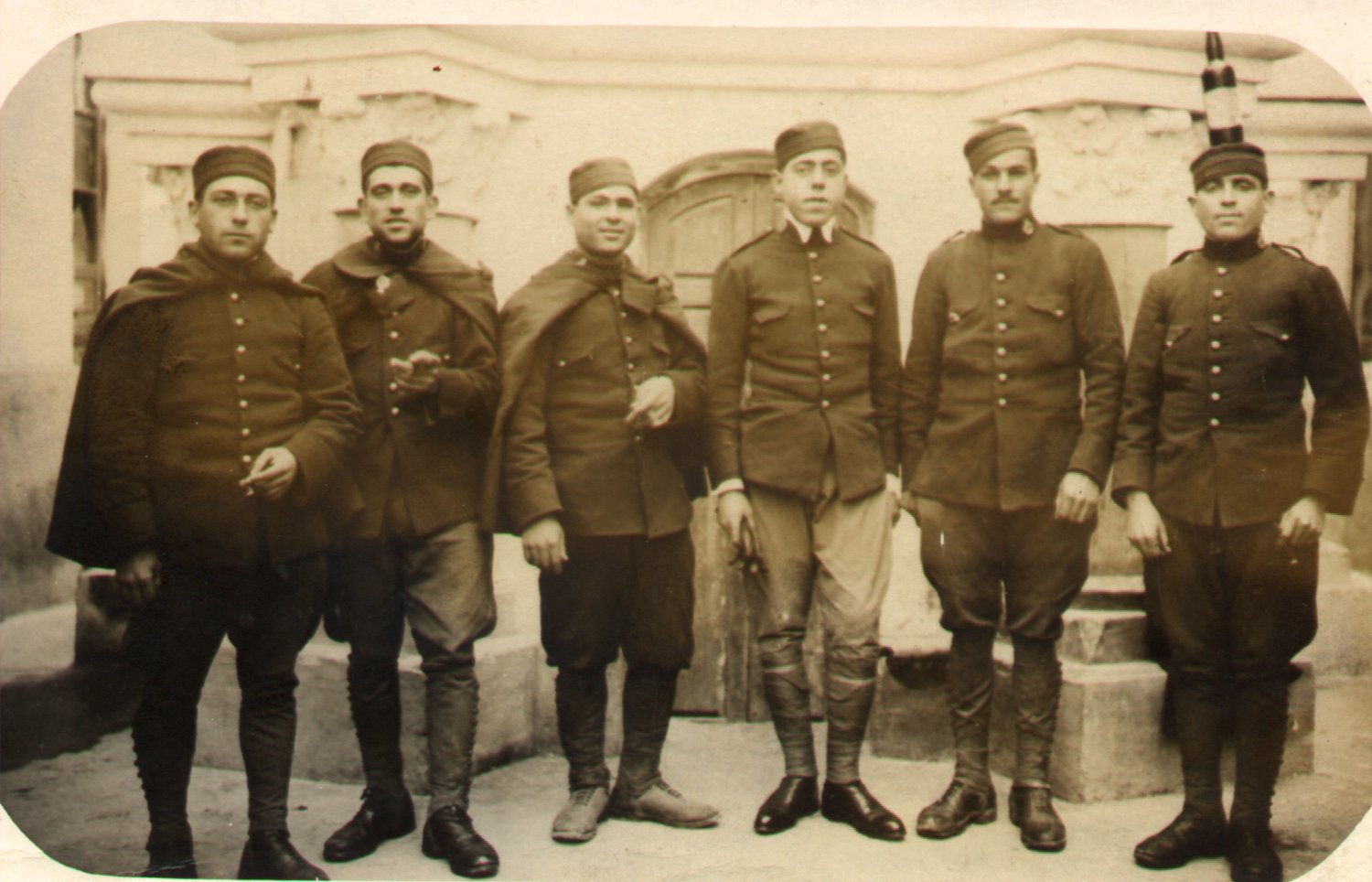 a group of men in uniform stand next to each other