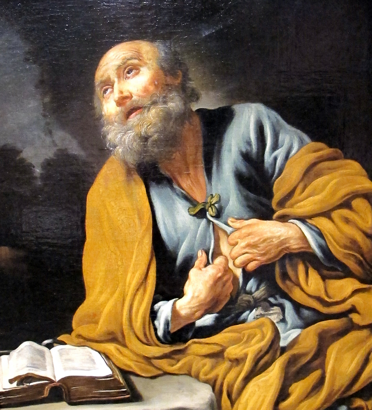 a painting of a man with a book and pen and two bibles