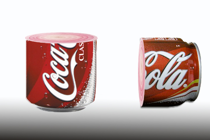 two cans of coca cola with white writing on them
