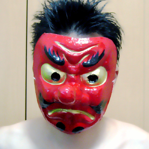the person has black hair and a red mask