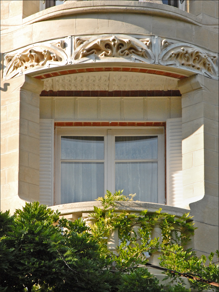 a window with a circular arch in an old building