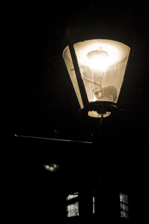 a street light at night with the light shining on
