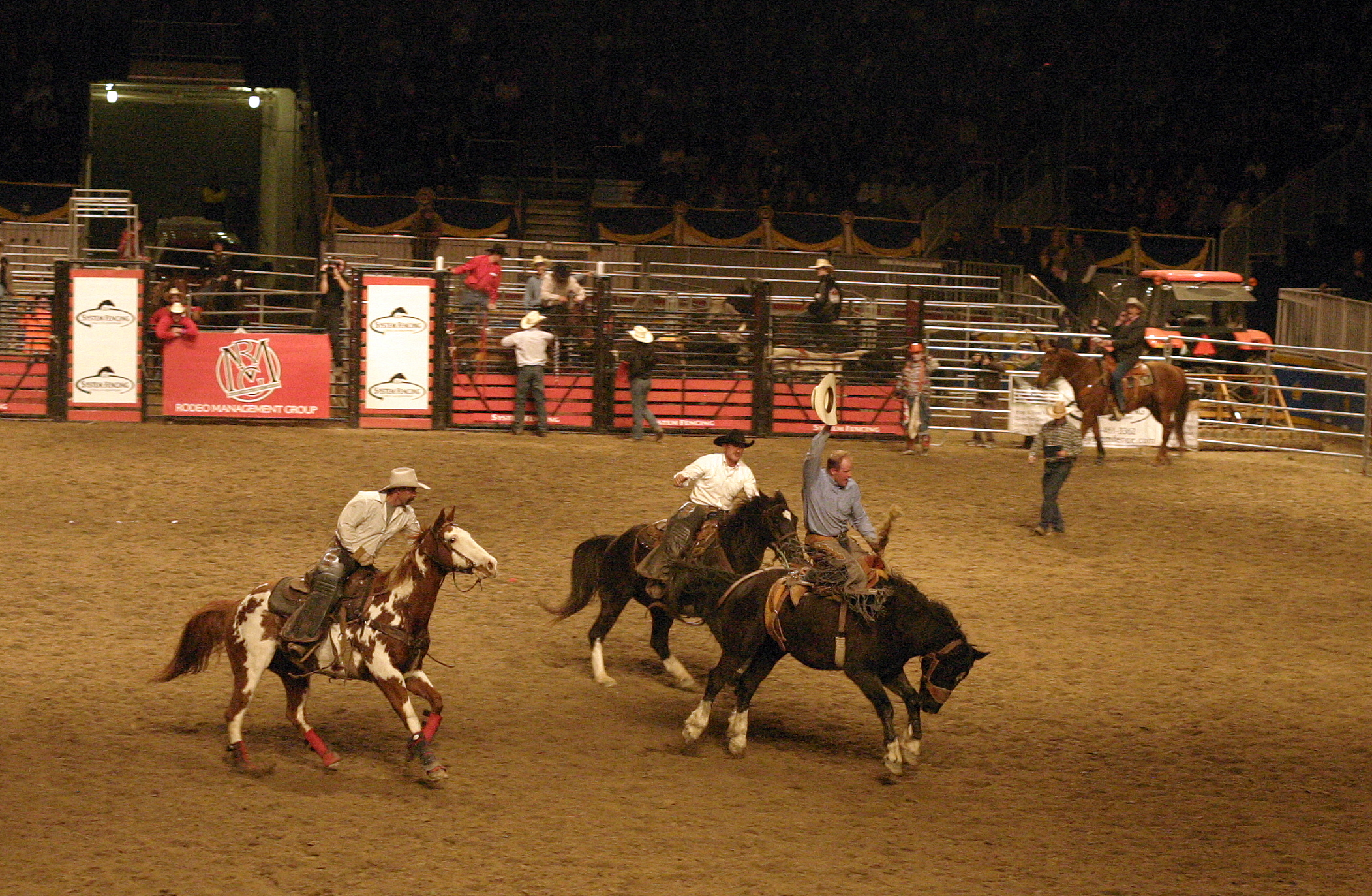 a group of men riding on the backs of horses