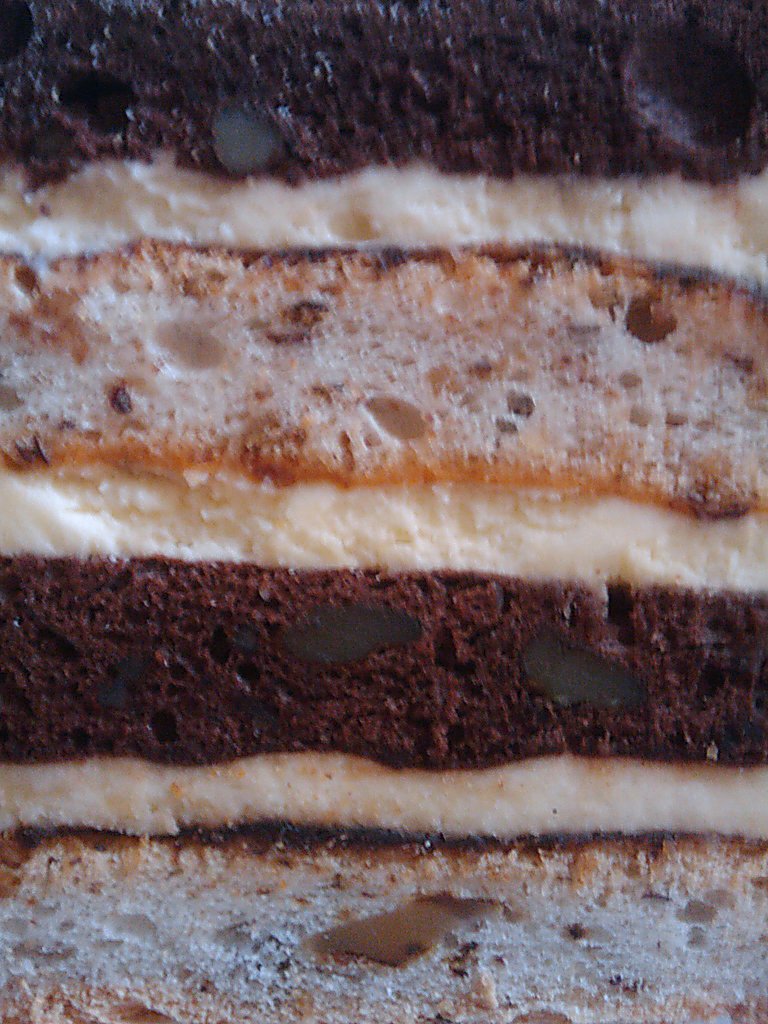 closeup of slice of cake with cookies on top