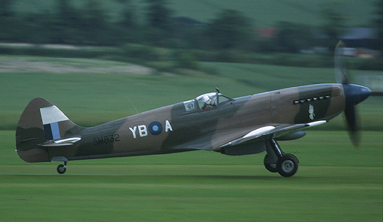 an old world war ii airplane taking off