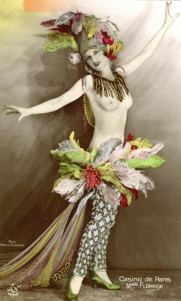 the young woman in costume is dancing in the room