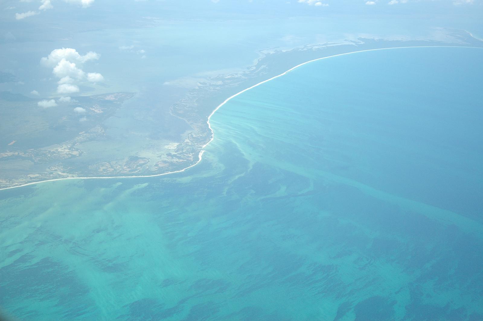 an aerial view shows a wide open beach