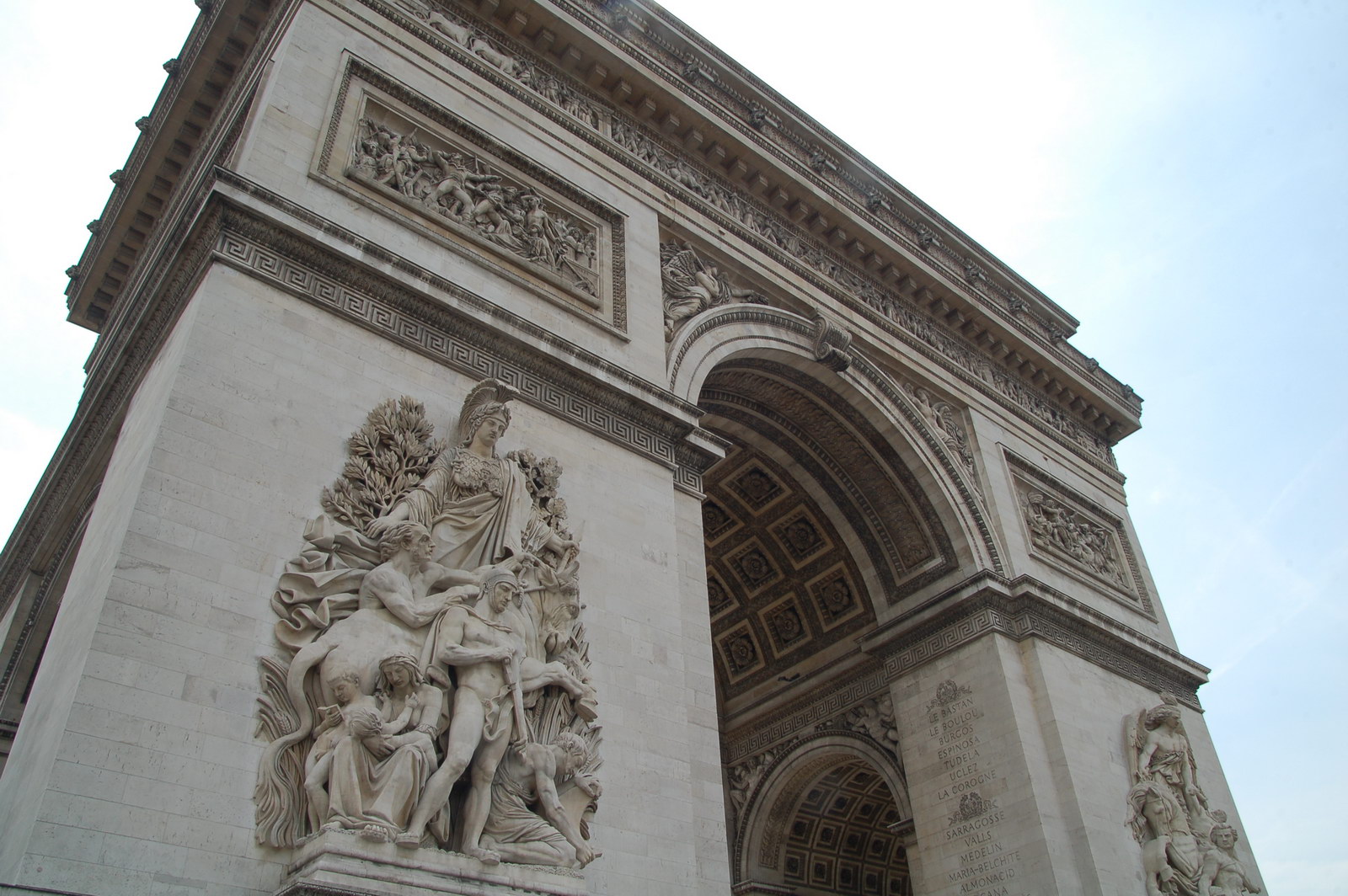 closeup of an archway in a building with carvings on the sides