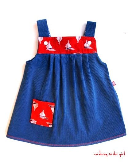 a dress with sail boats and blue fabric on it