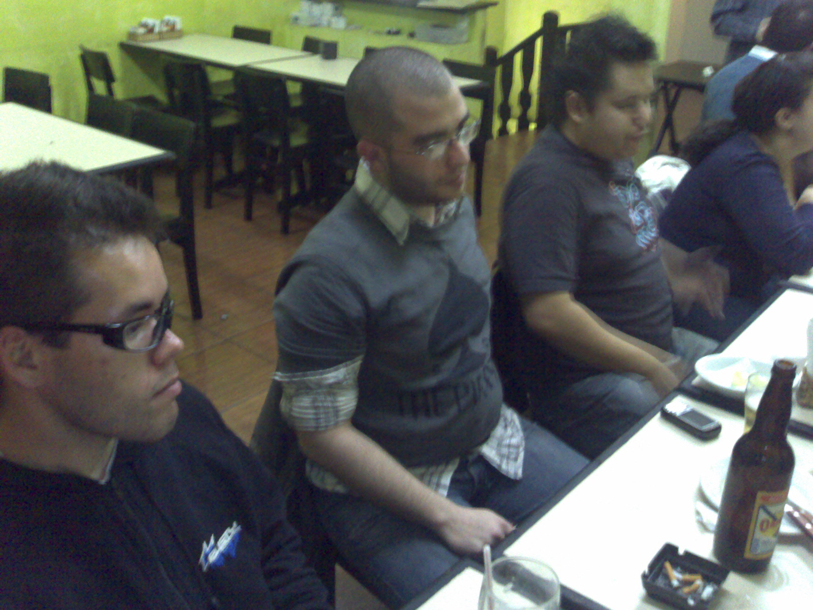 some guys sitting down together and having drinks