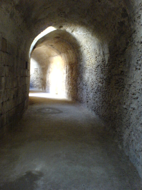 a dark tunnel that has light going through it