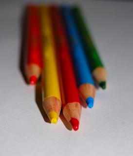 several pencils laying on top of a table