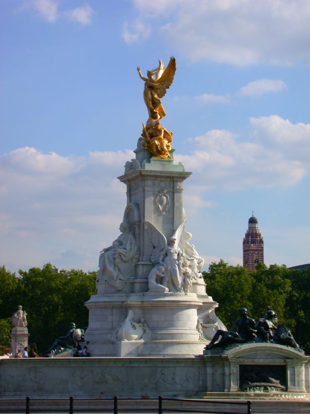 the statue is decorated with a gold statue on top