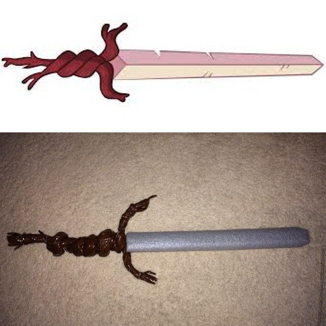 there is a large long sword with a lizard on it