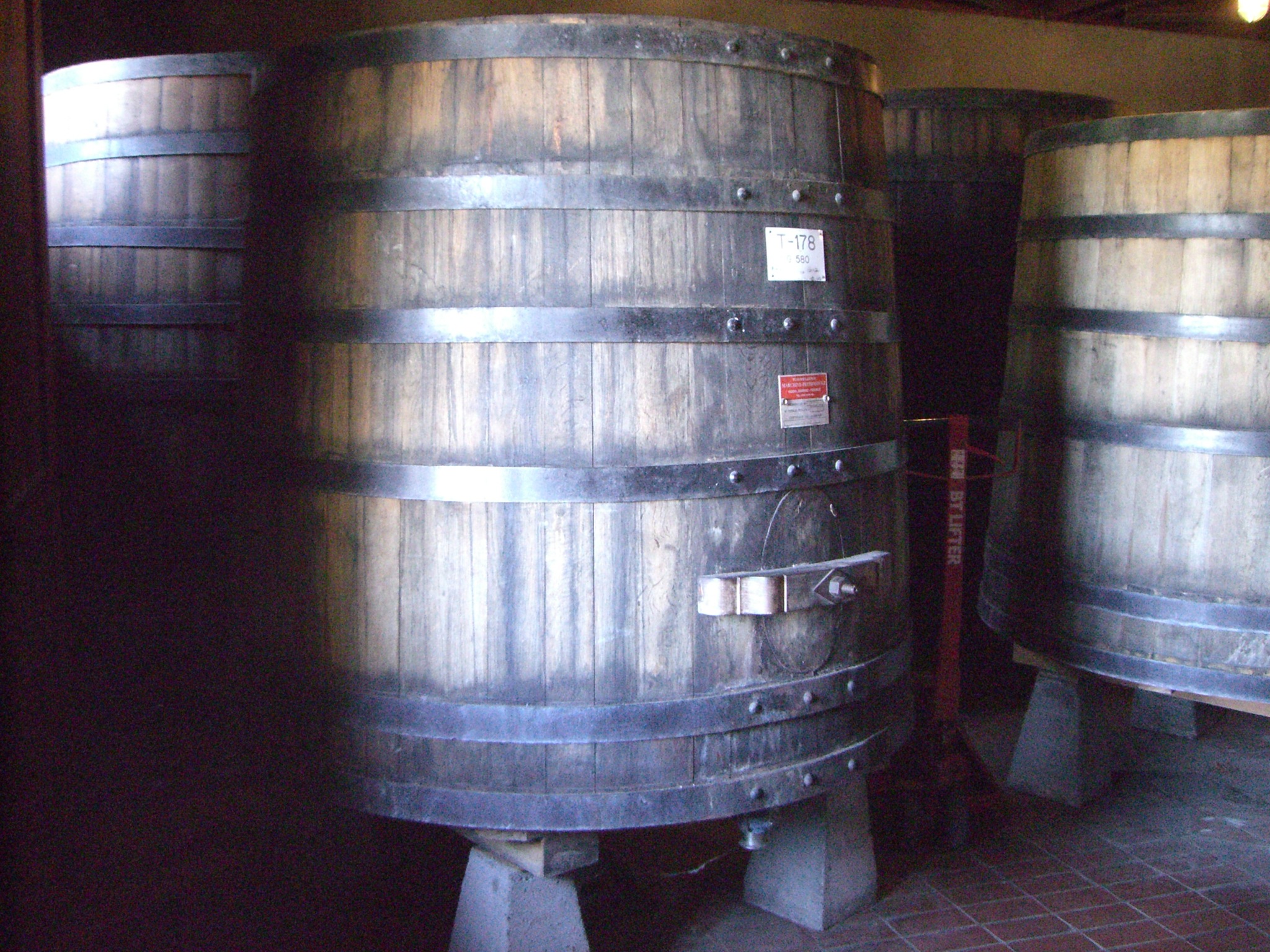 barrels for wine or beer are in a room