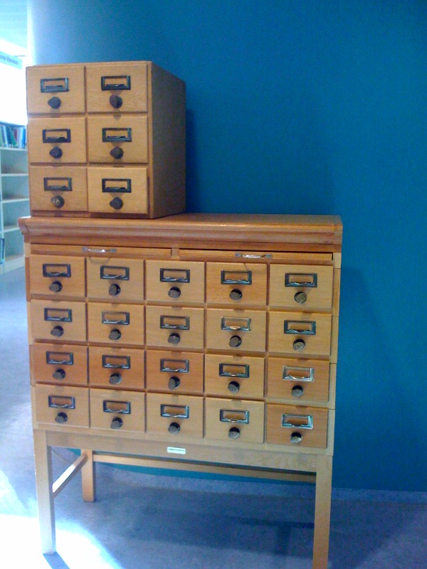 two stacks of drawer type items sitting in a room