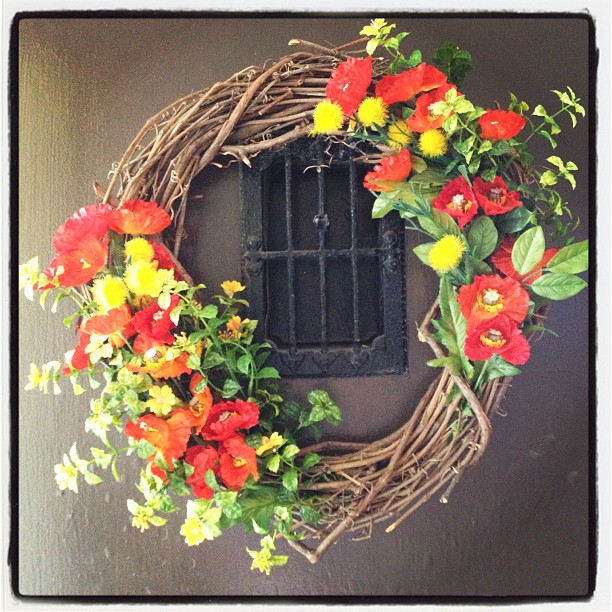this is a spring wreath with a small window