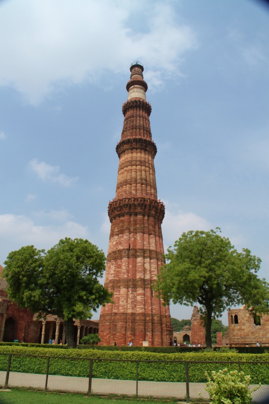 the large brick tower has a steeple at the top