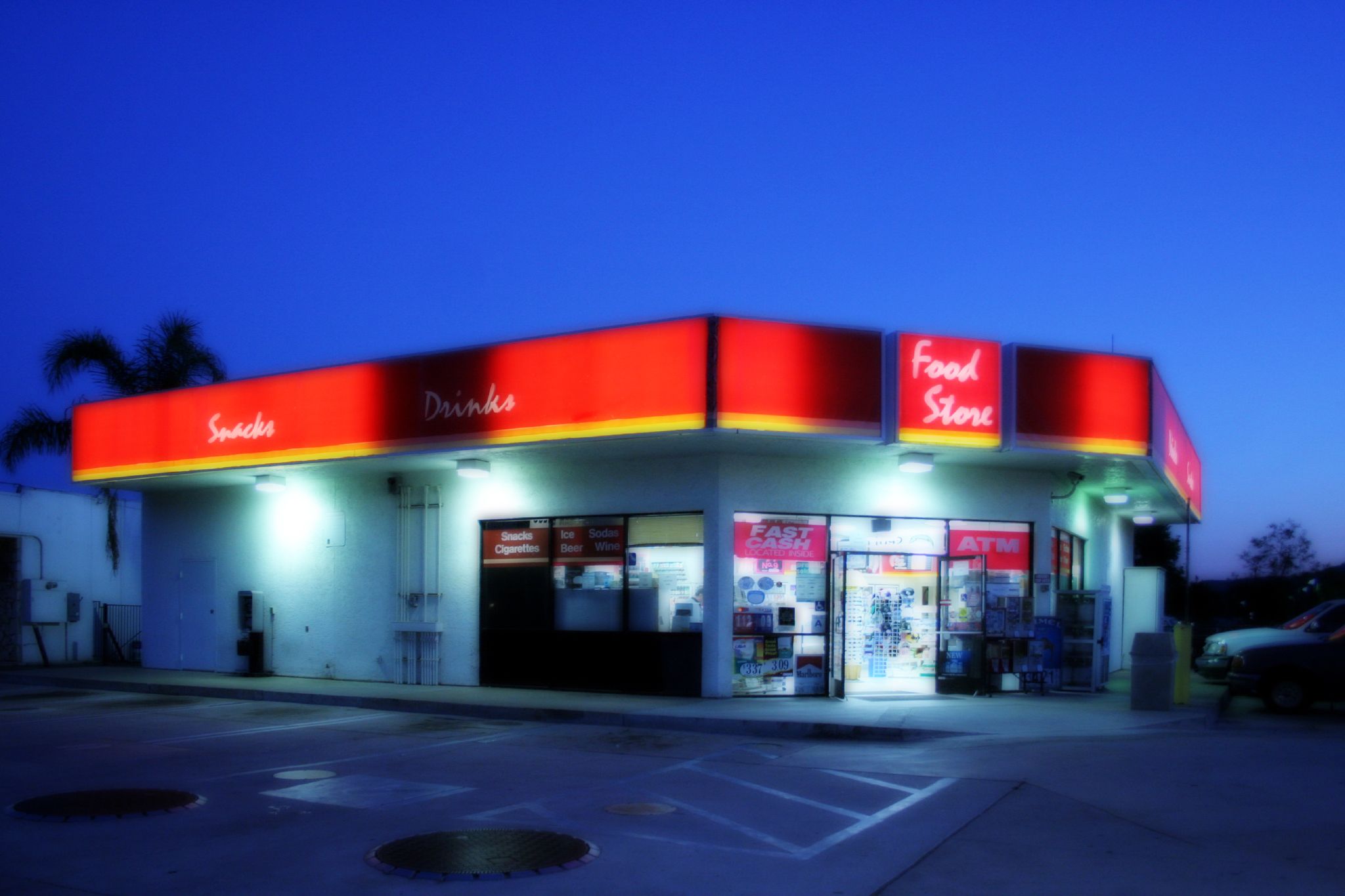 the front of a local gas station at night