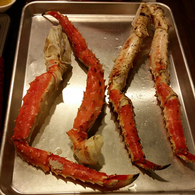 crab legs with claws and shells on a sheet