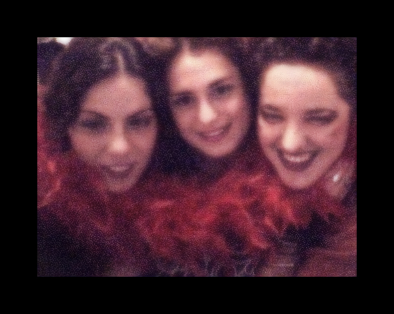a group of ladies smile with red hair
