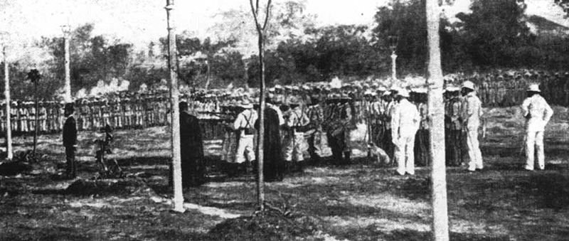 old time po of a war ceremony with men in white uniforms