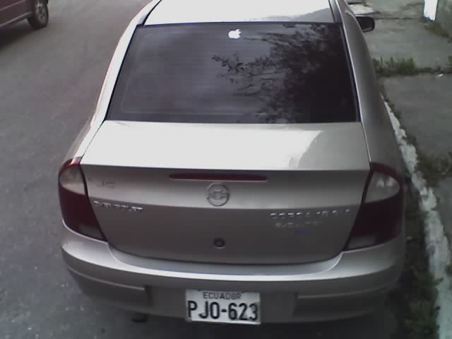 the rear view of a silver car on a street