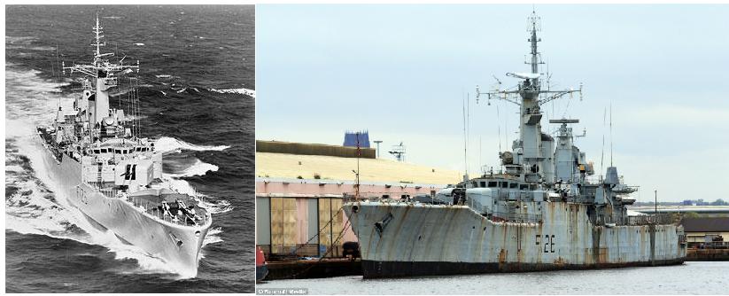 a navy vessel parked next to a bigger ship