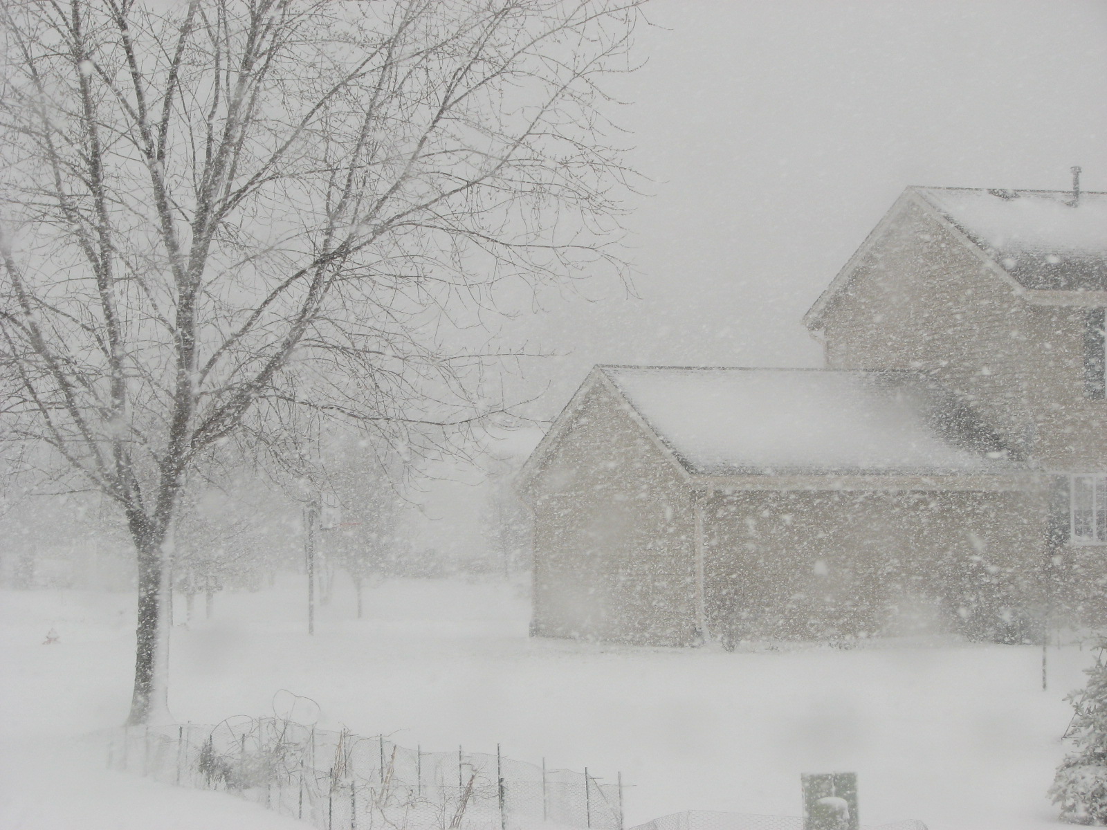 a large house covered in snow during winter