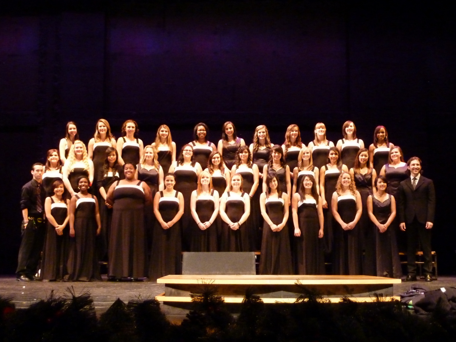 the choir is holding their instruments at night