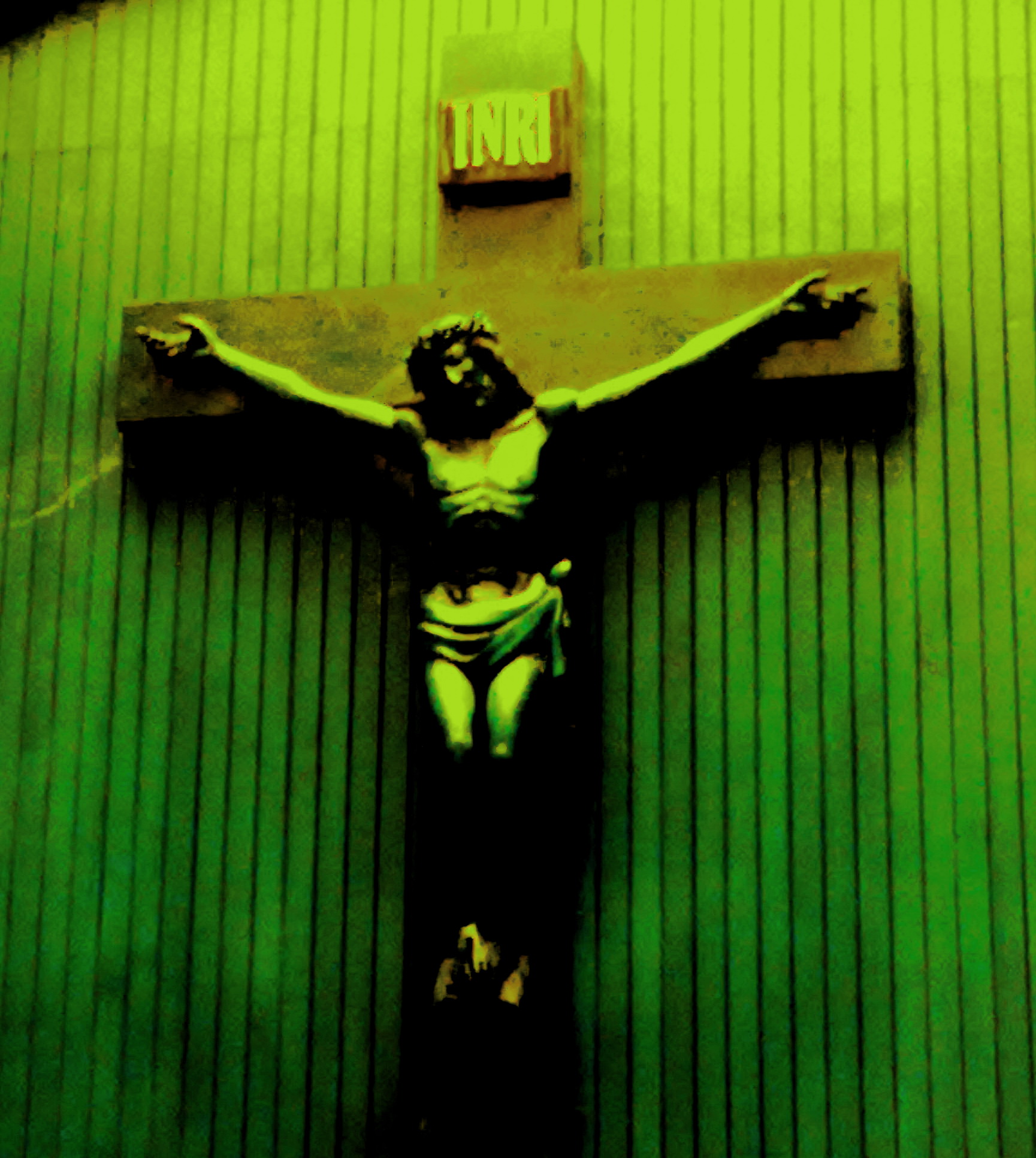 a person is posing for a po in front of a jesus cross