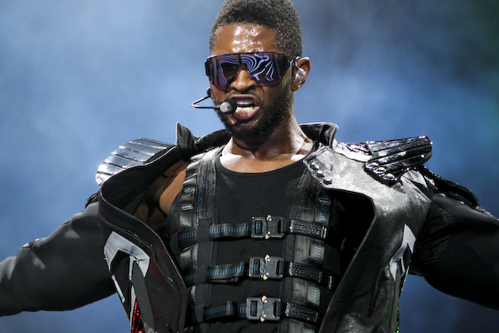 a man in black leather gear with sunglasses on