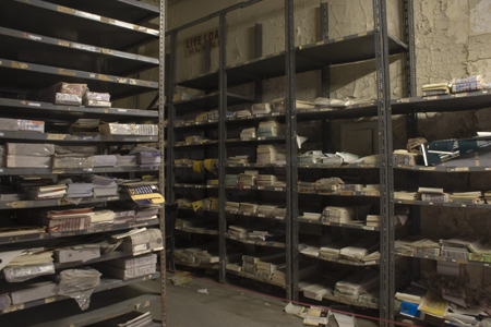 the shelves with many records are stacked together