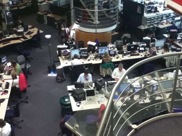 an aerial s of employees working on their computers