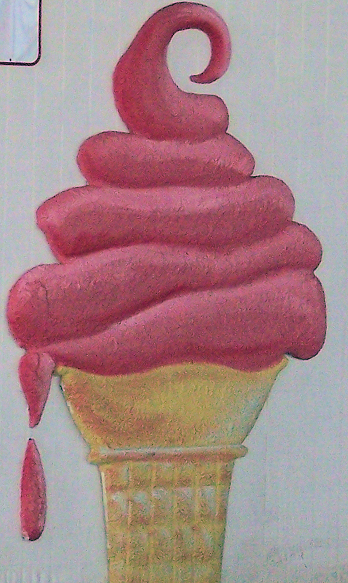 an ice cream cone with a pink swirl
