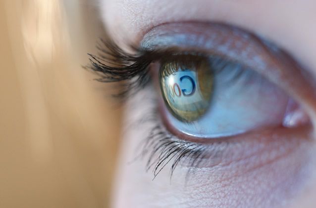 close up pograph of the human eye with blue eyes and one - on - one lens