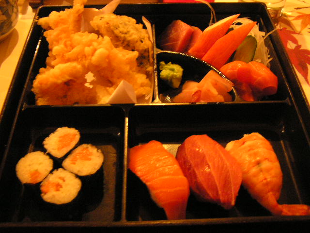 a tray with several foods sitting on top of it
