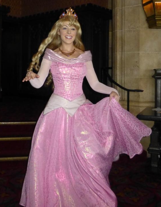 a blonde woman is dressed in a princess costume
