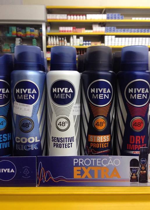 several bottles of deodorant and hair products are on a store shelf