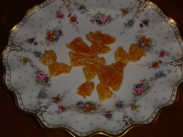 the plate is decorated with colorful flowers and fruit