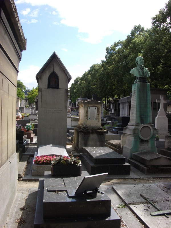 a view of a cemetery and a statue