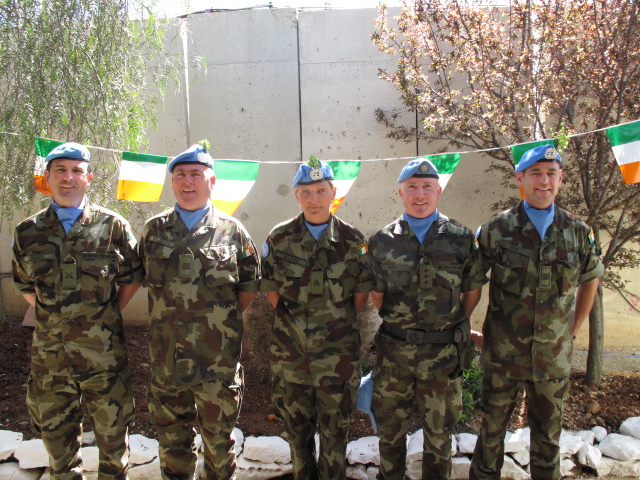 some military men in uniform standing together for a group po