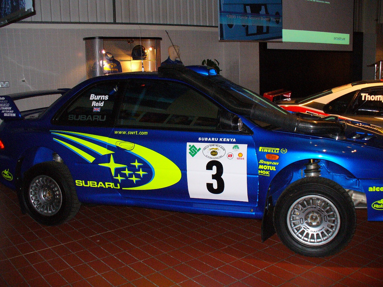 a small blue car with numbers painted on it