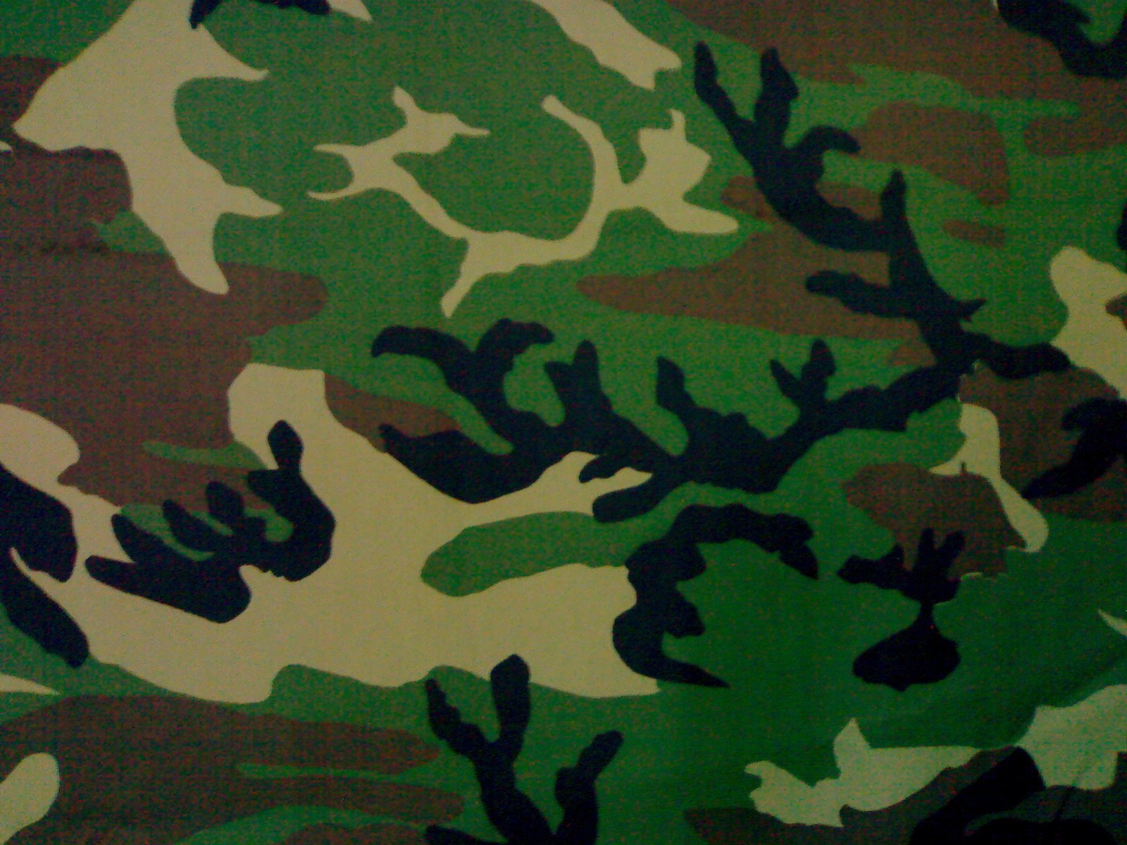 green camouflage print wallpaper on white with black edges