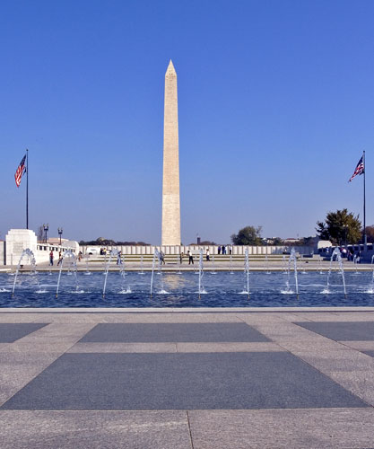 a view of the washington monument and a reflecting pool with water