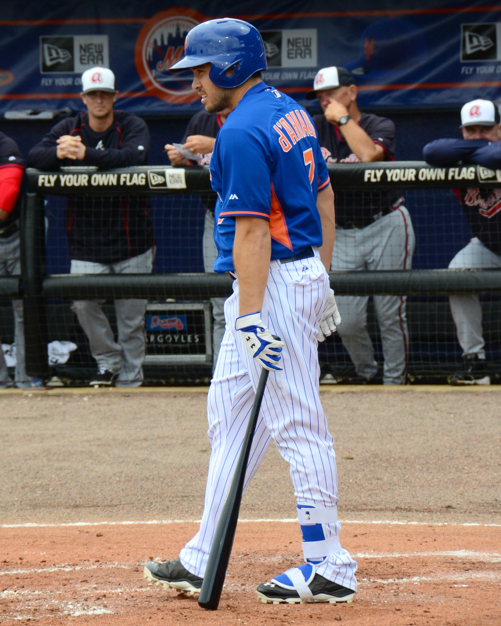 a baseball player is standing with a bat