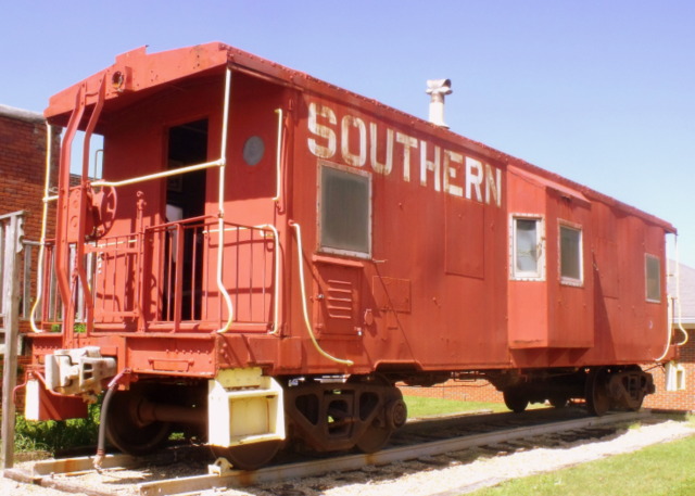 a red train car with southern written on the side