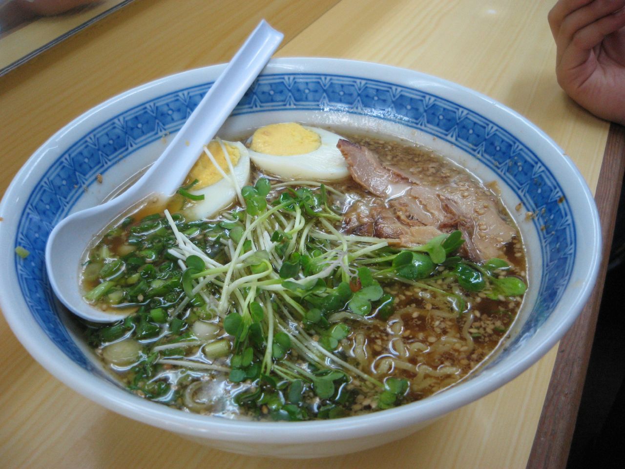 a bowl of ramen with some noodles and sliced eggs