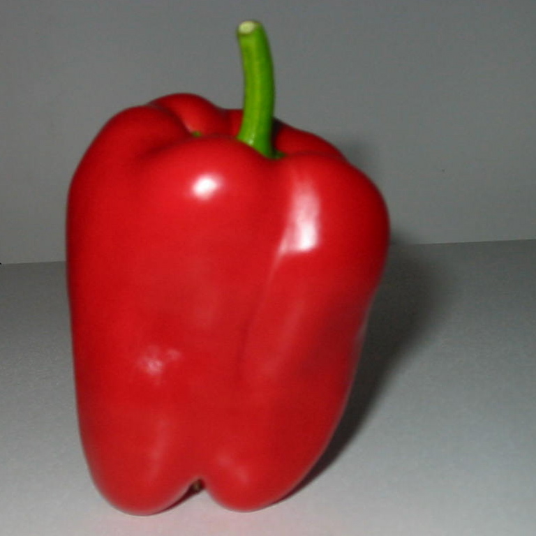 a bell pepper, cut in half to look like it's been peeled